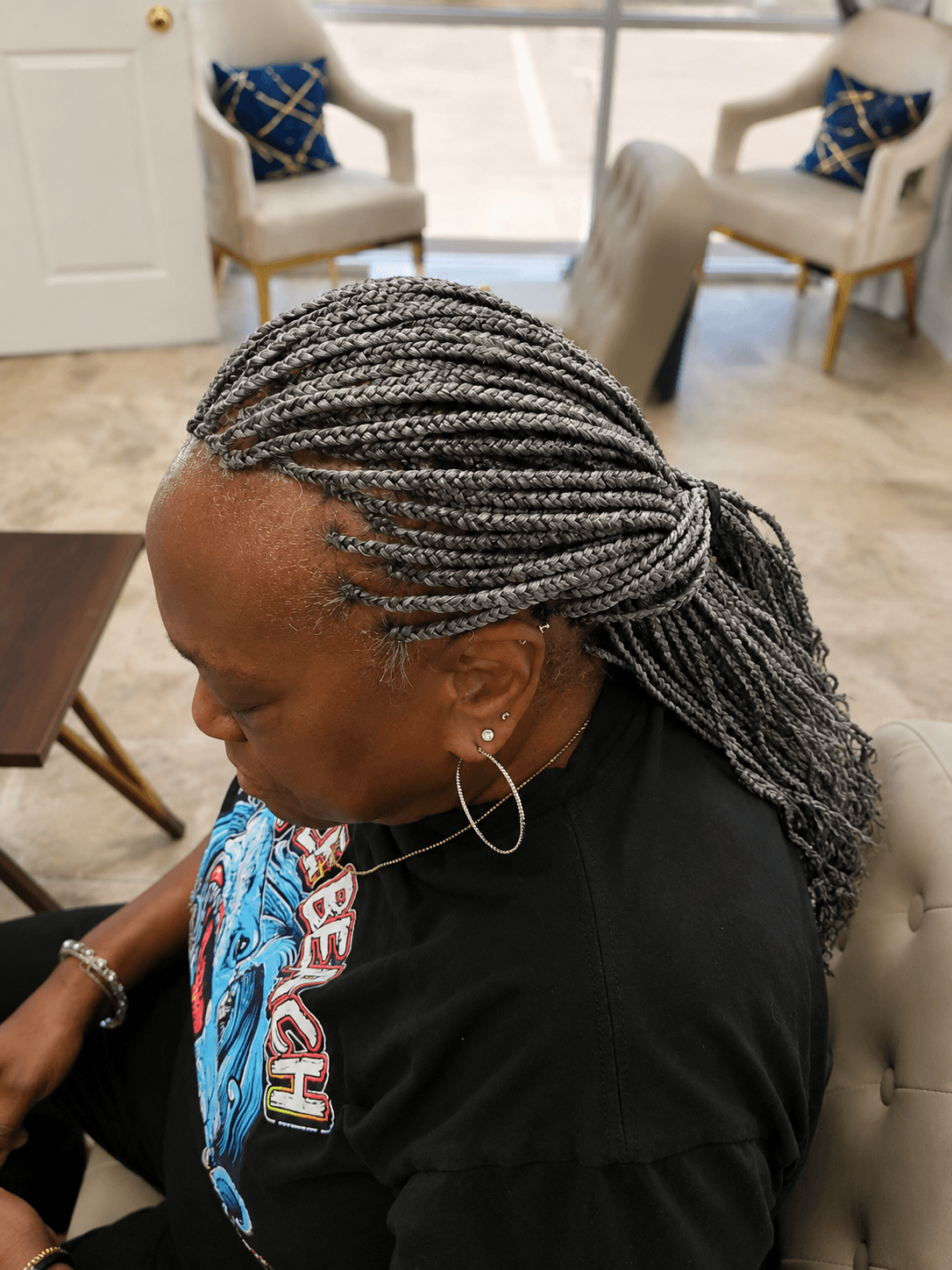 Long gray silver knotless braids — side profile view