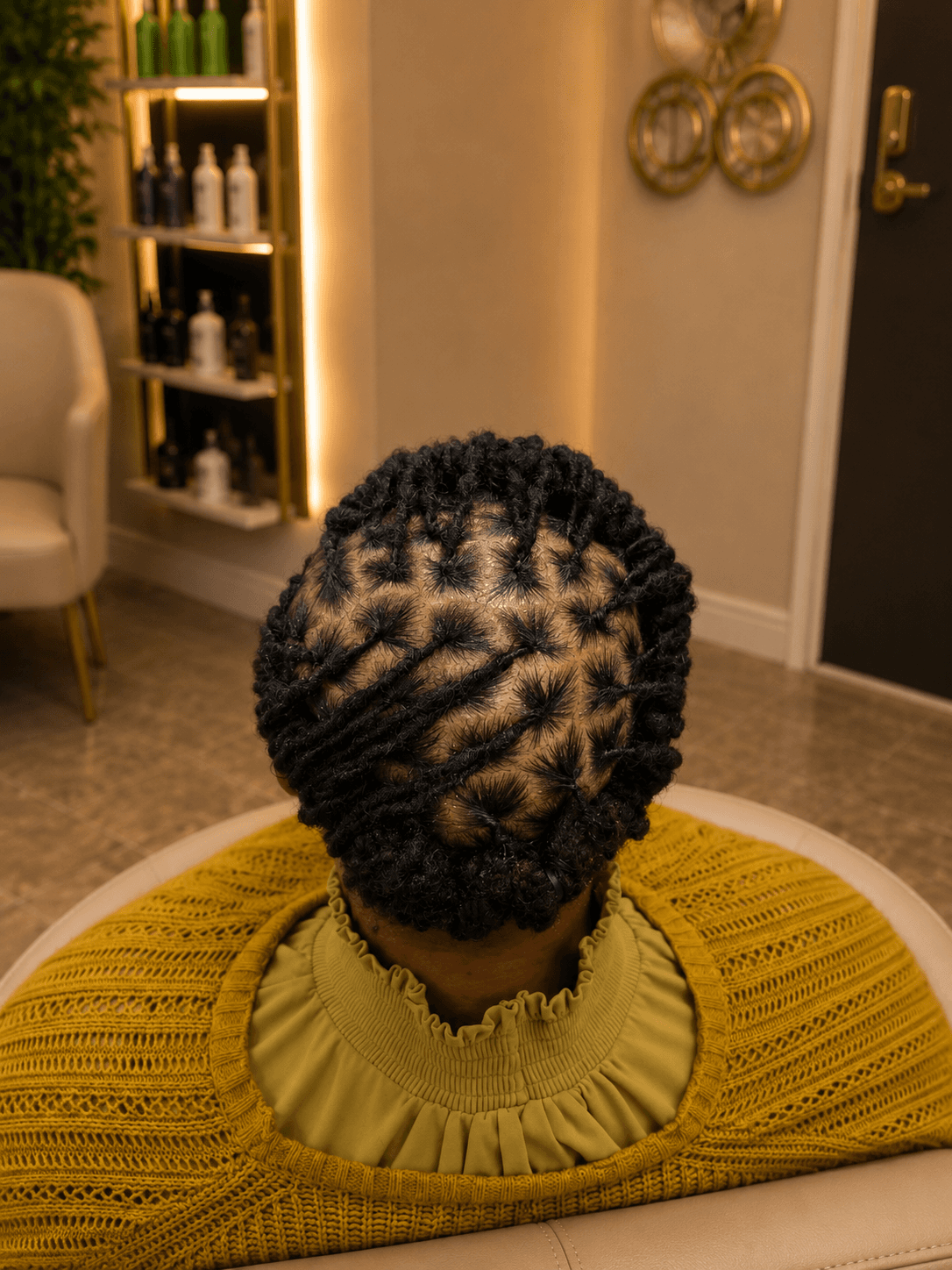 Short black kinky coil starter locs — top view